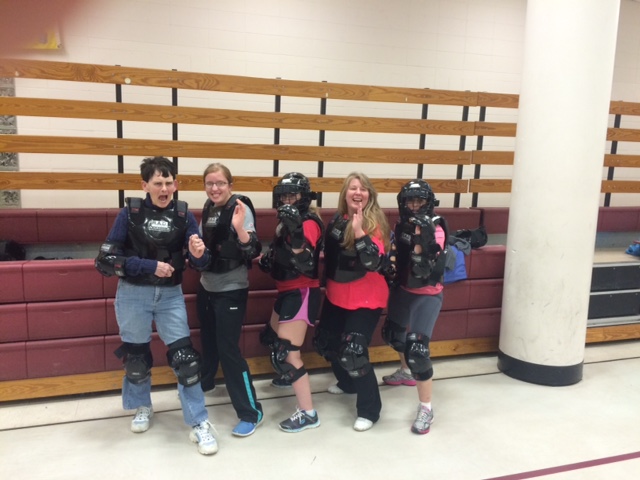 Participants in protective gear, ready to practice their defense skills at Dunstable's R.A.D. class in March.
