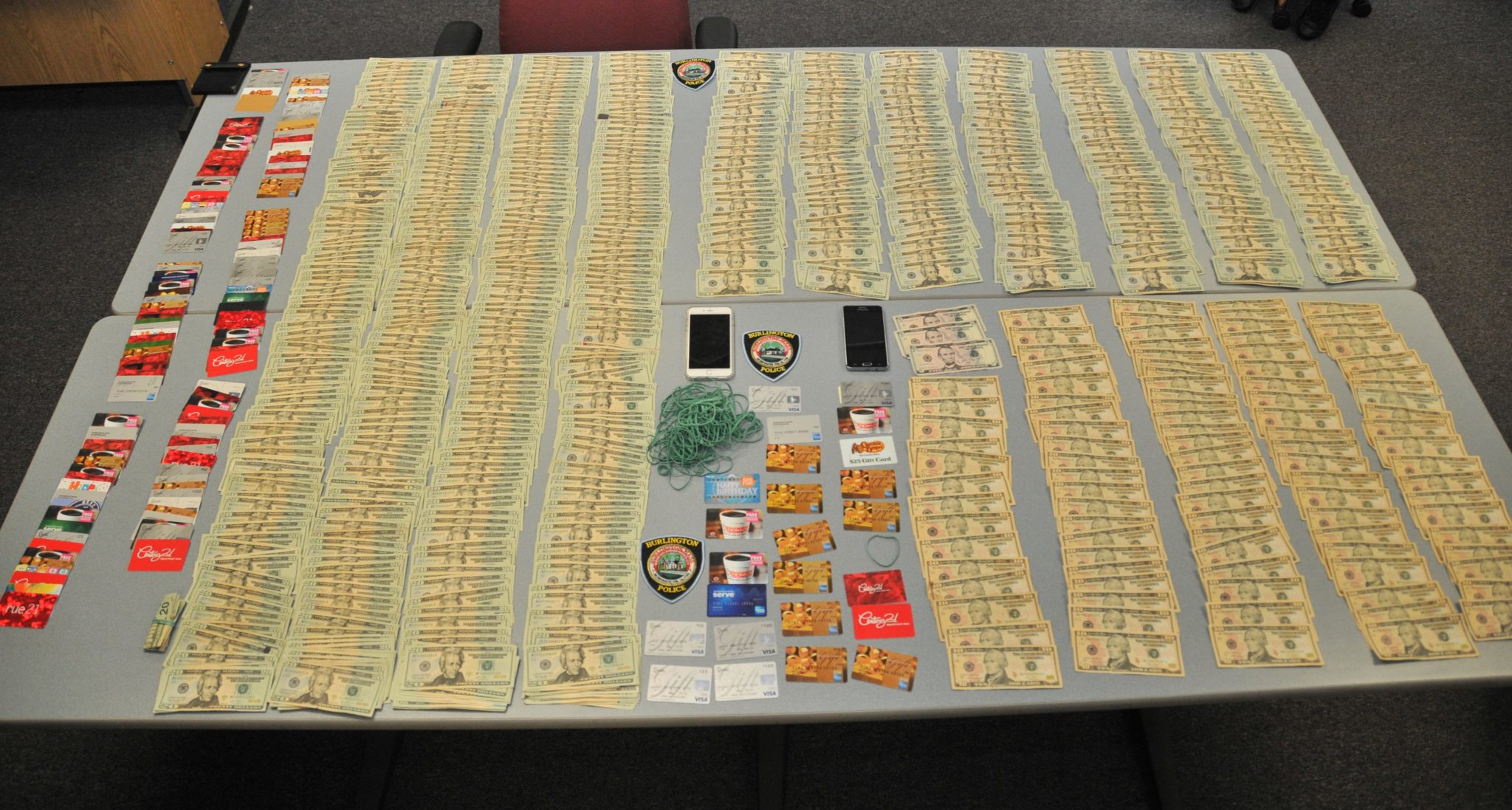 Police seized over $15,000 in cash and 150 fraudulent cards during their arrests of two suspects involved in a credit card ring. (Courtesy Photo)