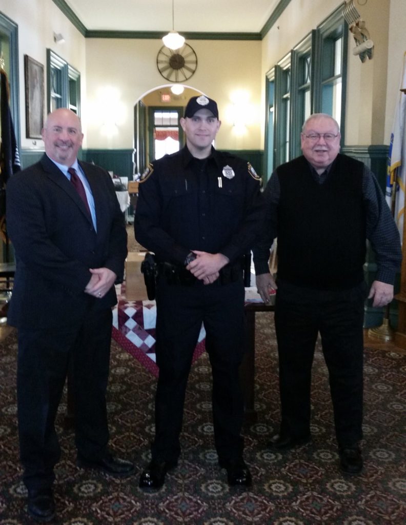 Pictured left-to-right: Saugus Police Chief Domenic J. DiMella, Officer Derek Ryan, and Acting Saugus Town Manager Robert Palleschi. (Courtesy of the Saugus Police Department)