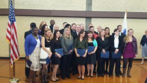 Meghan Feeney, front row, fifth from the left, graduated from the Public Safety Communications Academy this month. She will work as a civilian dispatcher for the Bedford Police Department. (Courtesy Photo)