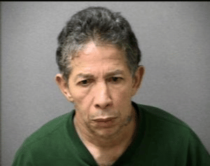 PORFIRIO SANTIAGO, AGE 55, OF LOWELL. (Chelmsford Police Booking Photo)