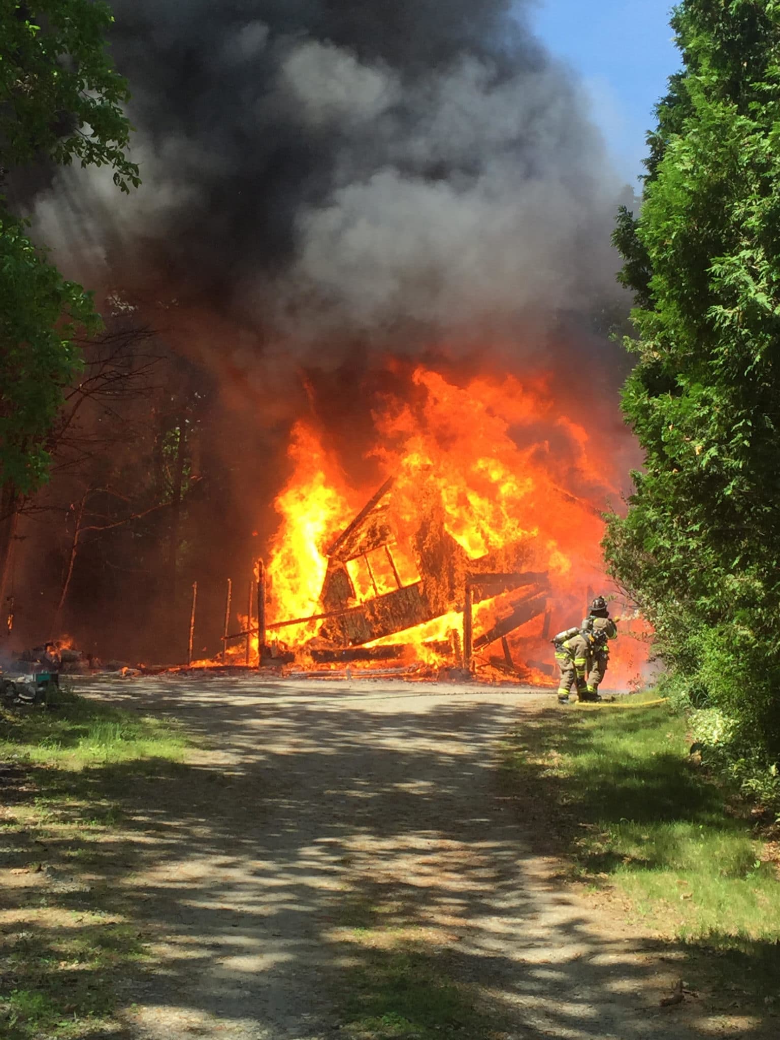 The Groton Fire Department extinguished a five-alarm garage and brush fire today (Courtesy Photo).
