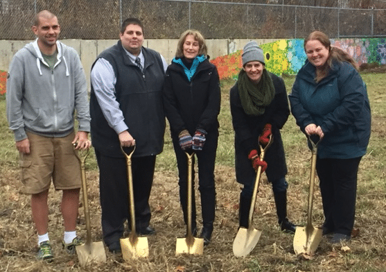 Maynard officials broke ground on the Honeybee Meadow Project today. Left to right: Richard Shea of Yieldbot (a local company that provided a significant contribution to the crowdfunding effort), Town Administrator Kevin Sweet, Conservation Agent Michele Grenier, artists and HoneyBee Park champions Denise Shea and Melissa Ljosa.