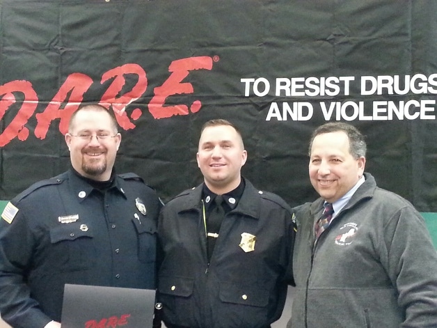 Pictured left-to-right are Officer Woodworth, Sgt. Kmiec, and Domenic DiNatale, Director DARE Massachusetts at Officer Woodworth's D.A.R.E. Officer Graduation ceremony held in Concord NH. (Courtesy of the Ipswich Police department)