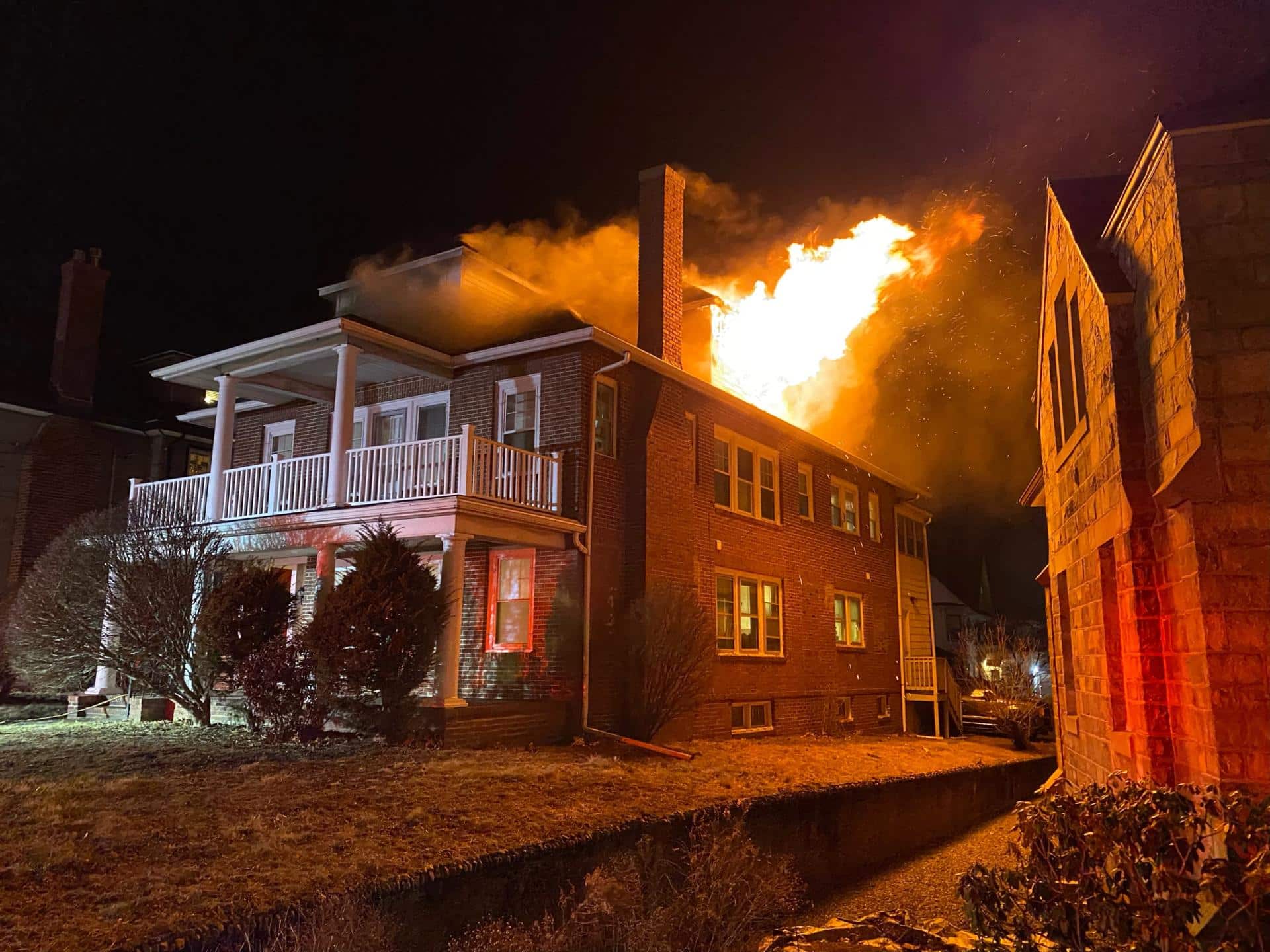 Flames shoot out of window of home on fire